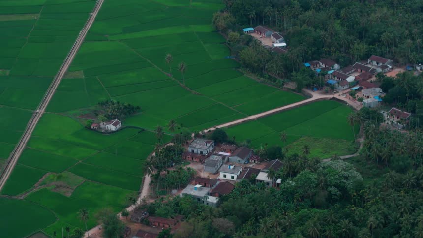 A small town with trees and grassy fields