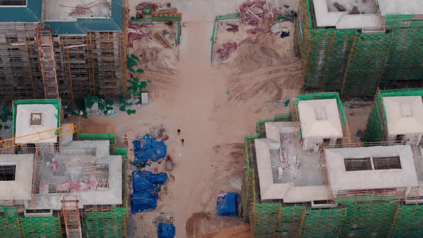 Aerial view of tall apartment buildings under construction