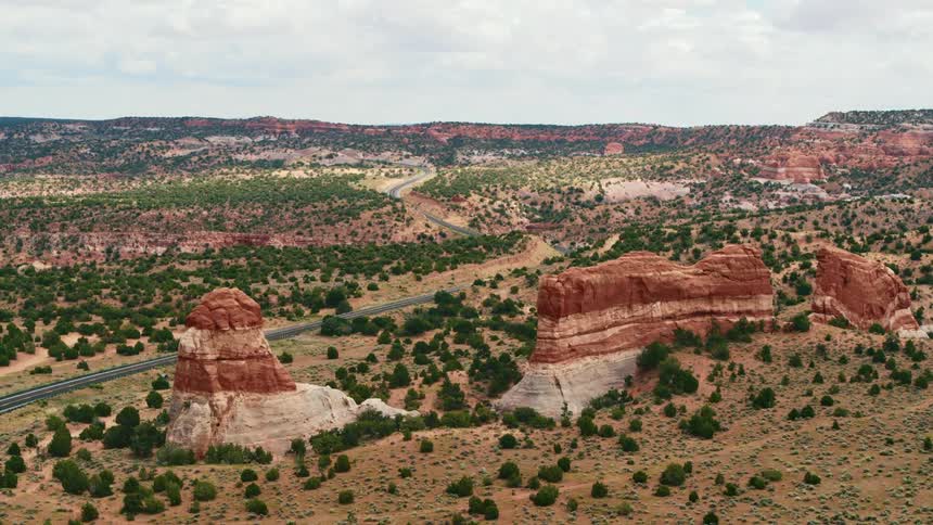 An aerial view of red rock formations in the wilderness