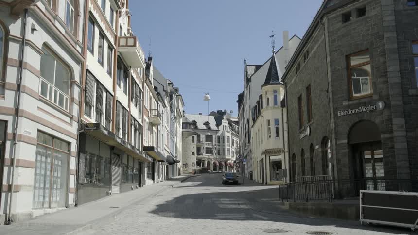 A stone street between two sets of buildings