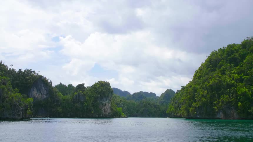 Sailing through a river near some rocks