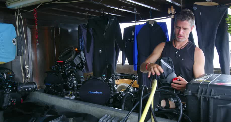 A man picks up scuba equipment