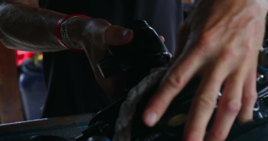 A technician assembling a mounted camera in a workshop