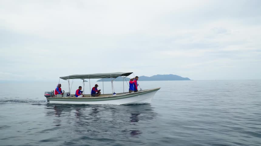 Rangers on a patrol boat