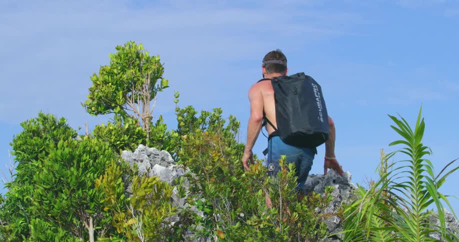 A man is hiking in the wilderness