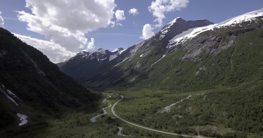 A road twists through a mountain