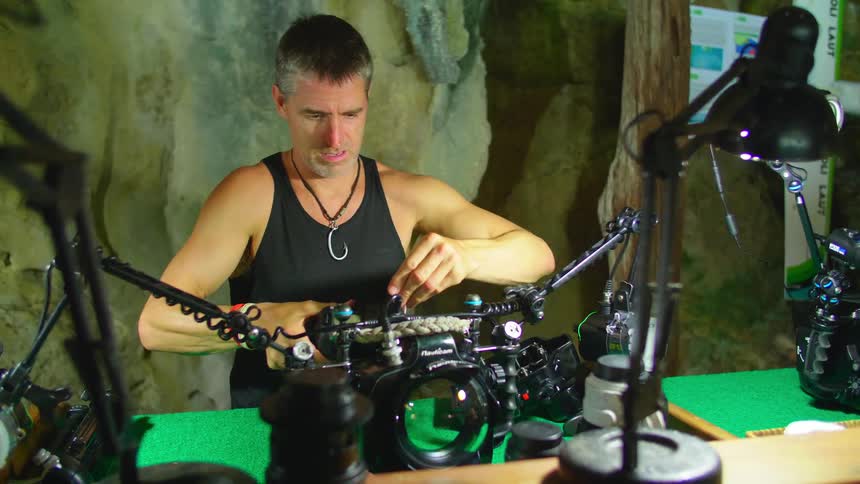 A man is setting up his cameras