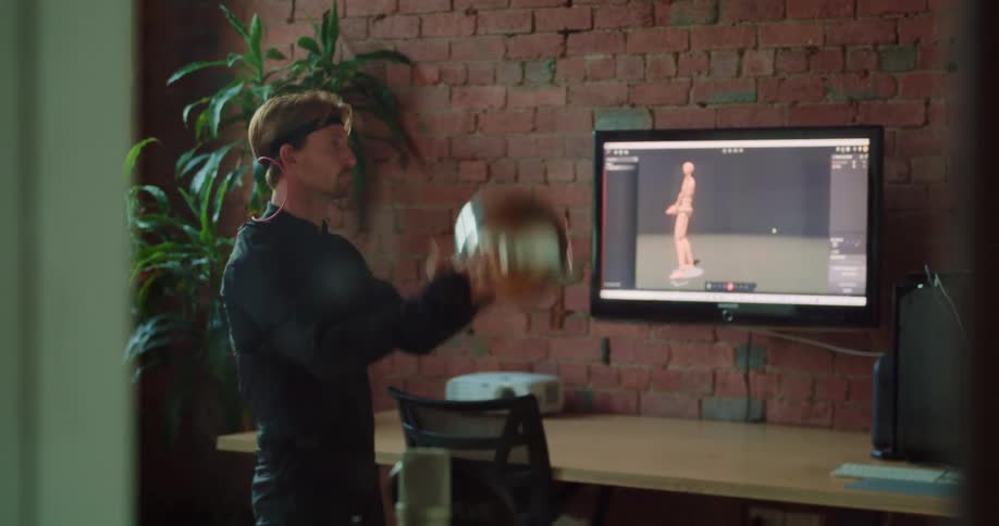 Designer recording a sequence of motion capture in a studio