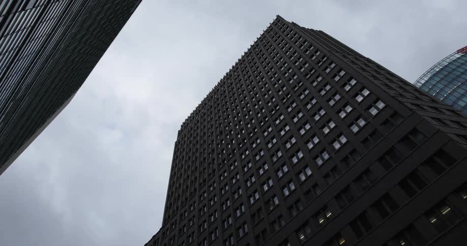 A skyscraper in a metropolis on a cloudy day