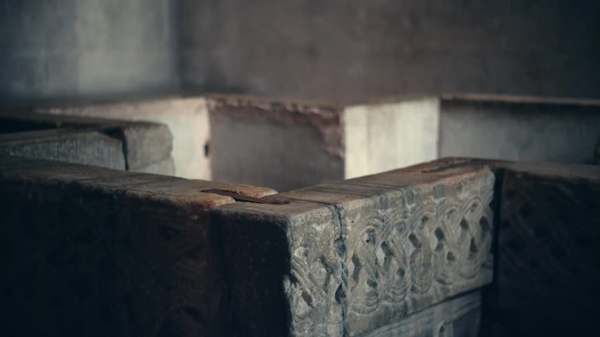 A view of a concrete pool in a building