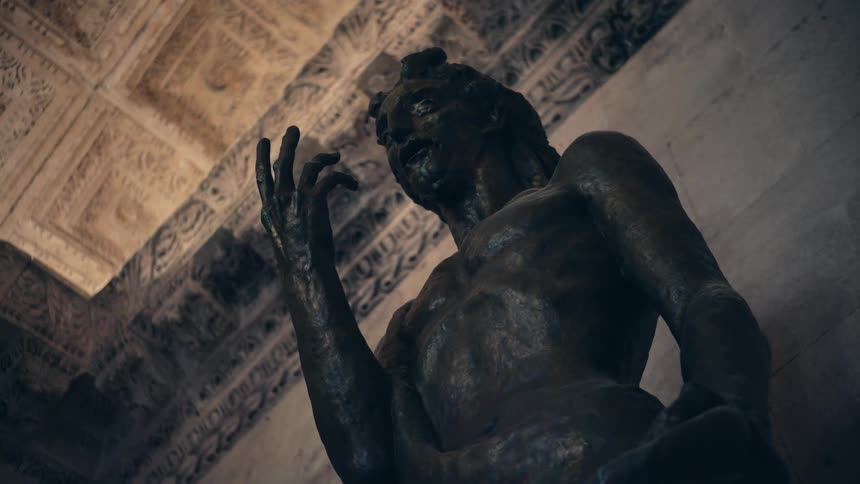 A large statue is against the wall