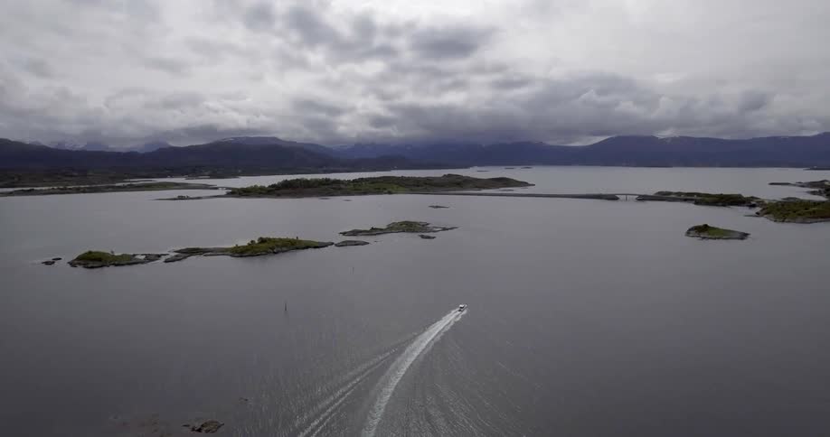 A boat sails near some small islands