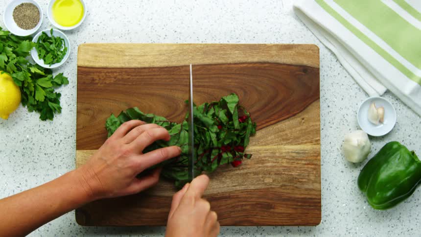 A person is cutting vegetables