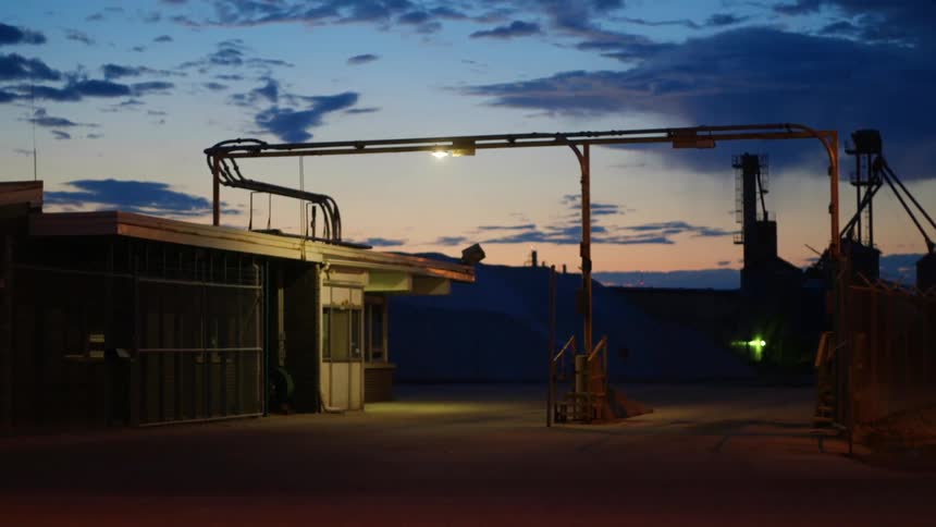 Doors to factory remain wide open at night