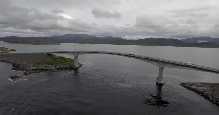 Vehicles across a bridge that connects small islands of land