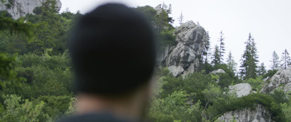 A man is hiking outdoors in spring