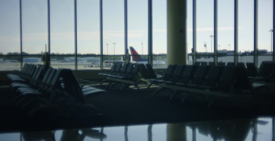 Empty rows of seats in an airport terminal in the daytime