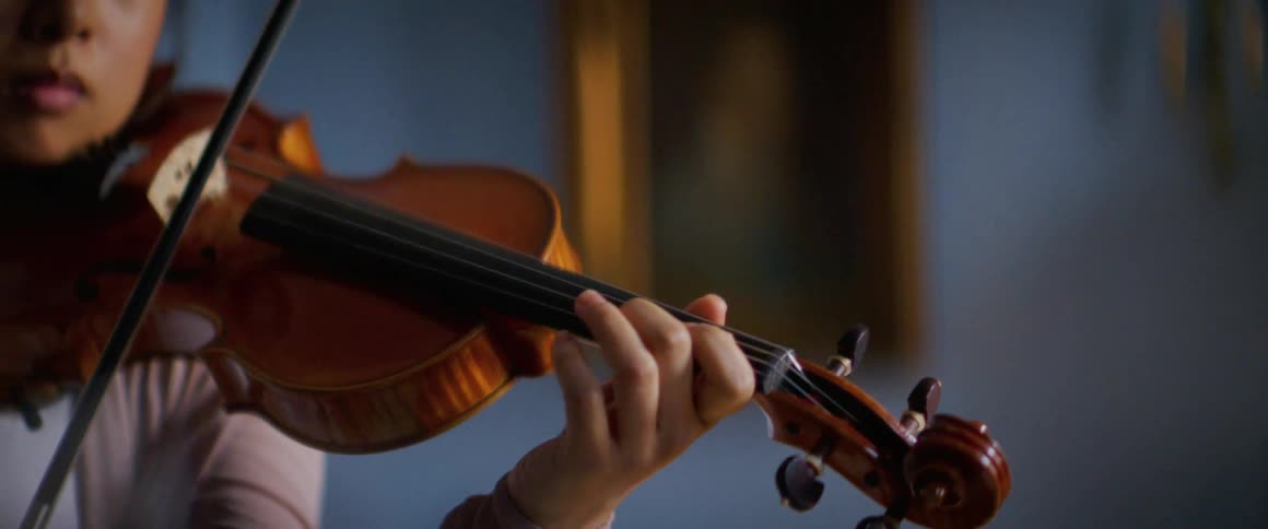 A woman is playing a musical instrument