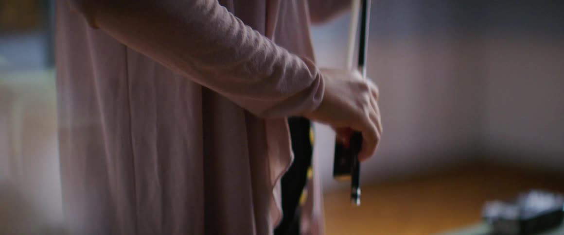 A woman is playing the violin