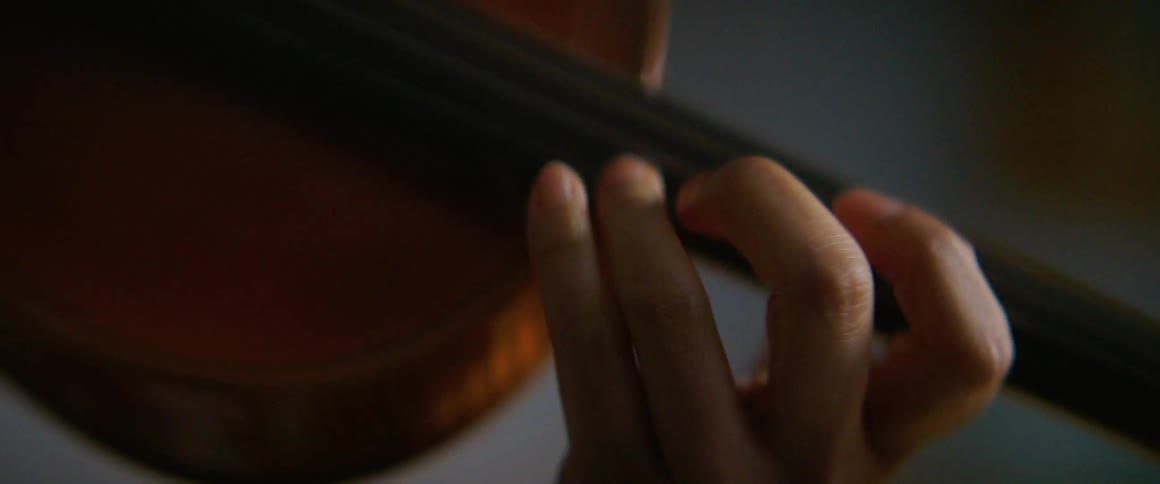 Close up of a woman playing a violin