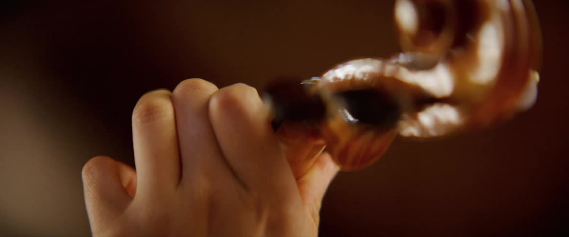 Close up of a female violinists hands playing a violin