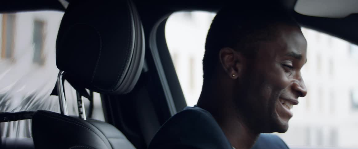 A man video chats while sitting in a car
