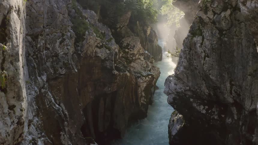 An aerial view of a river flowing between canyons