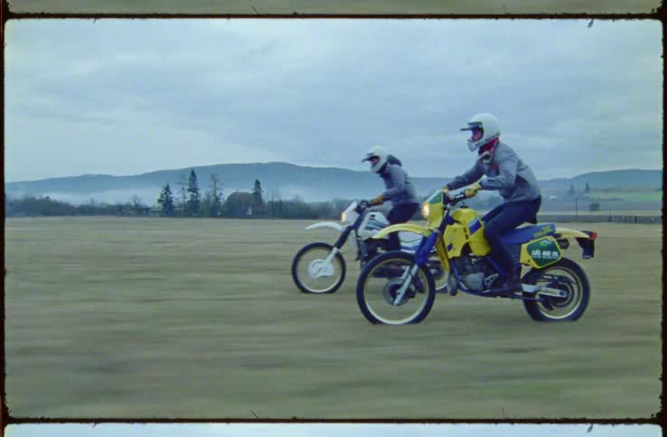 A film strip of two people riding motorbikes