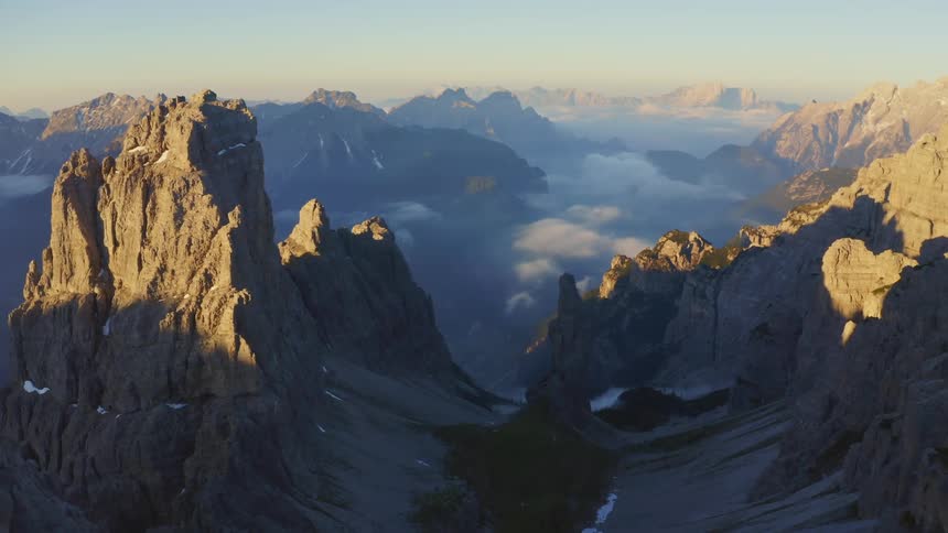 Aerial view of mountains at dusk is displayed