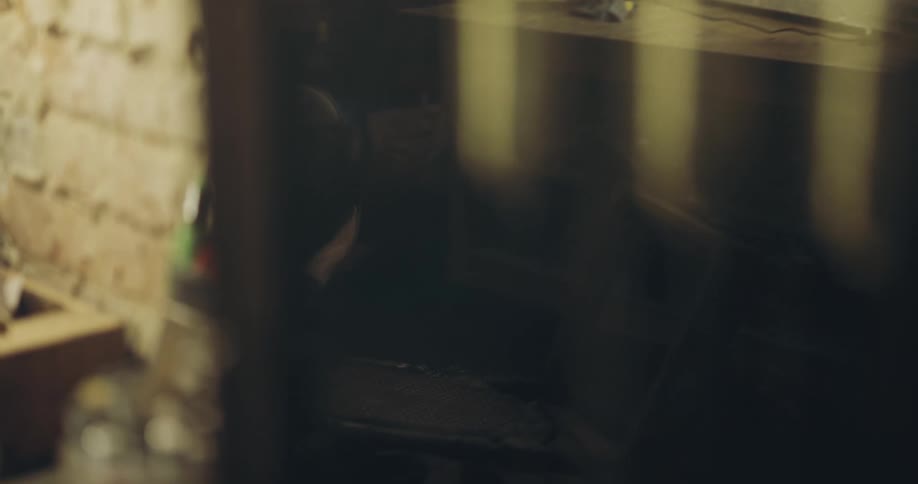 A man is working on something in the shop