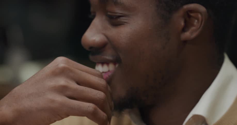 A young black man laughing