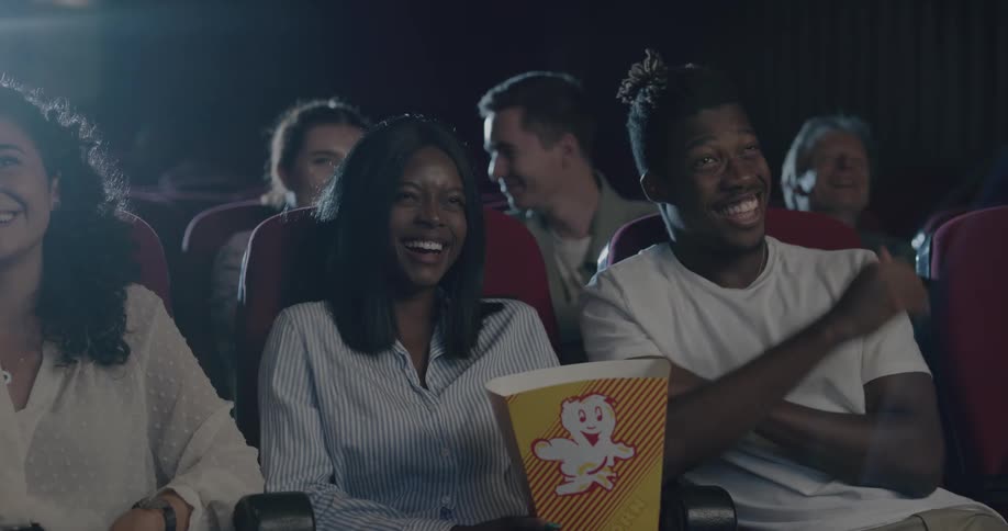 People laughing in a movie theater