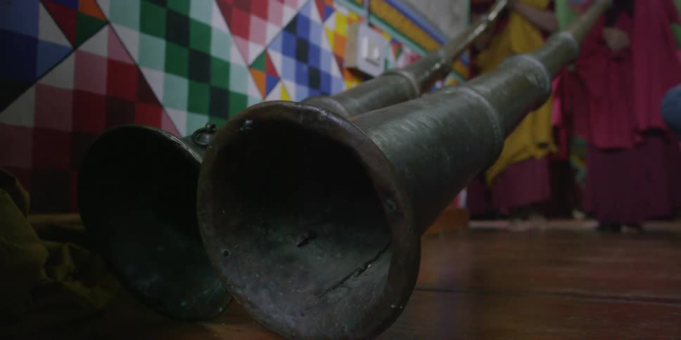 Buddhist monks playing long horns