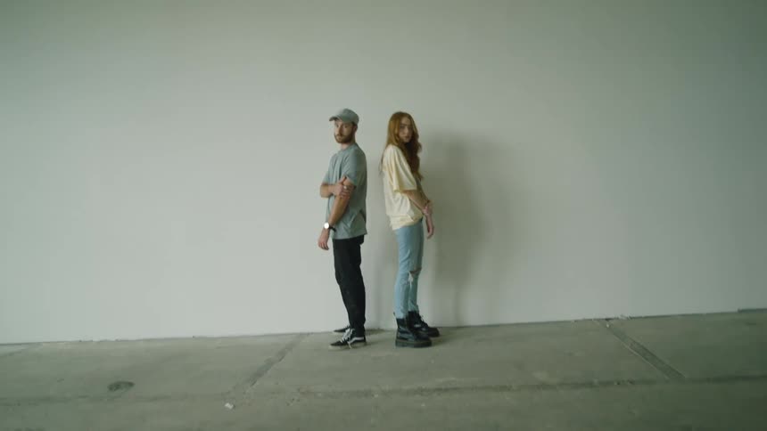 A man and a teenage girl pose for a photo