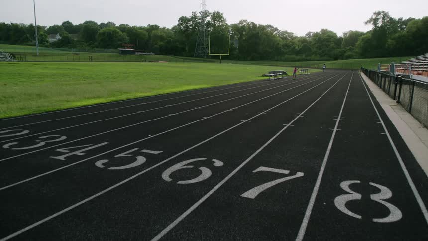 Athlete warming up on the olympic race track at morning