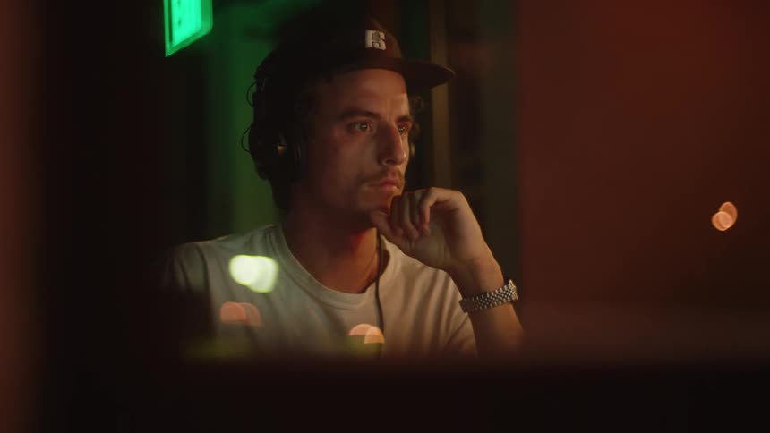 Man working on computer in a music studio