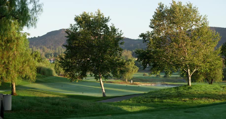 The golf course is empty during the day