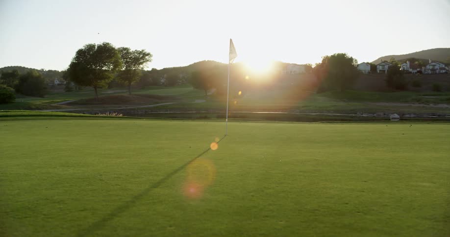 The golf course is empty at sunrise