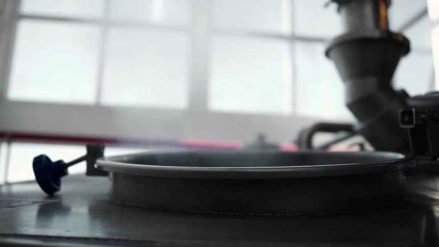 Steam rises from a hot pot sitting near the windows