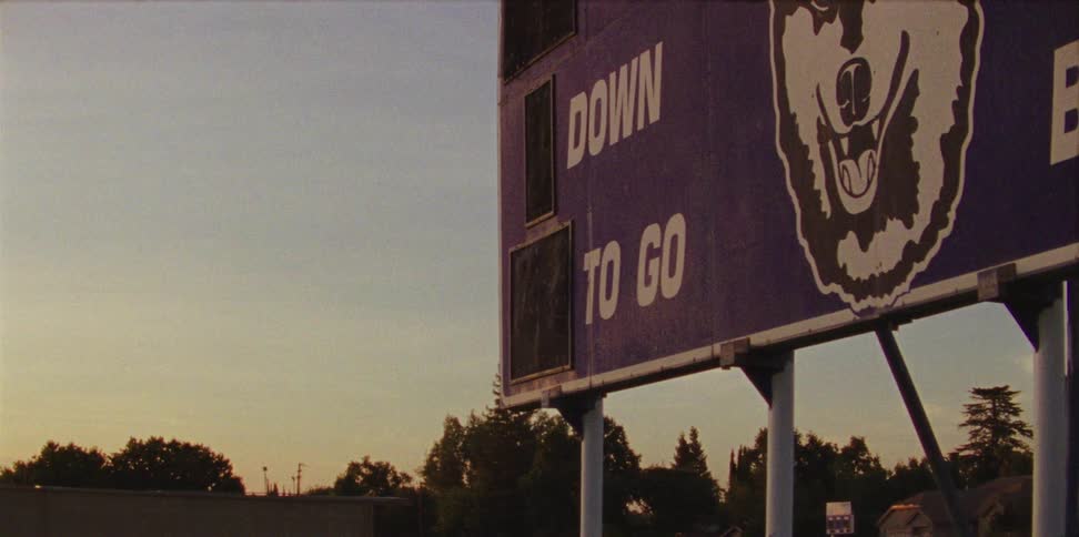 Sun light touches a purple scoreboard