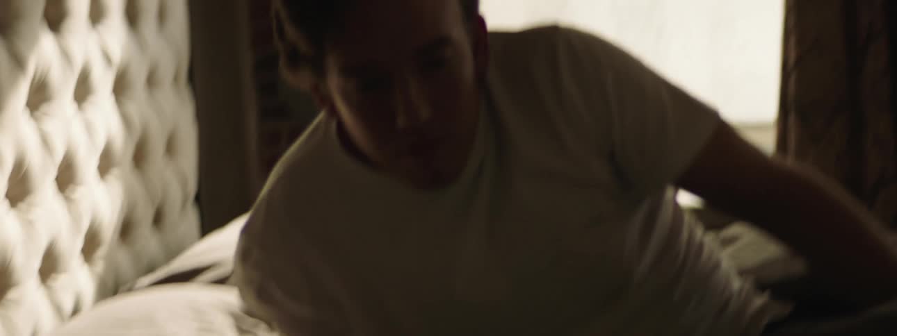 A man is sleeping in his bedroom
