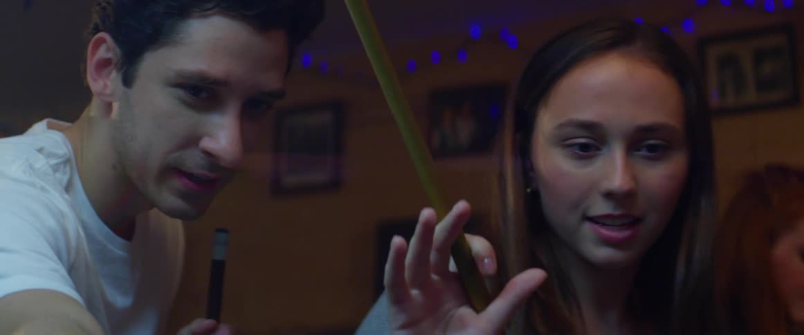 People play pool in the bar