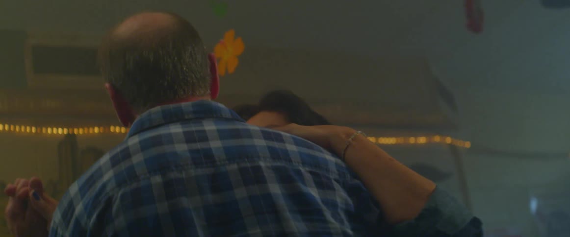 A husband and wife slow dancing