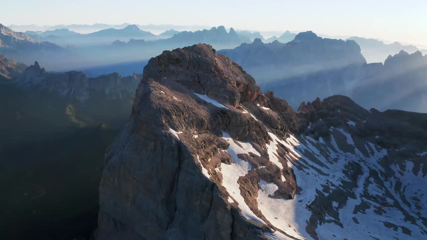 Aerial view of snow covered mountains are displayed