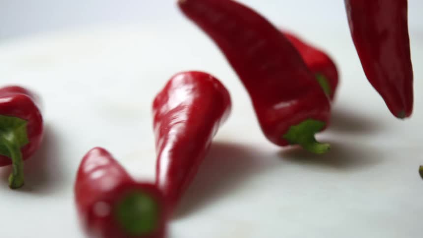 Peppers are dropped on the table