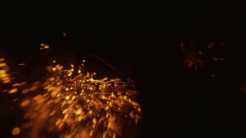 Orange strings of light bouncing in the dark