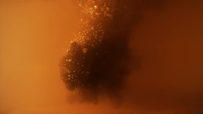 Bubbling orange liquid