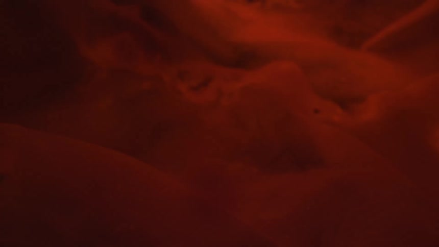 Smoke floating with orange red and dark hues