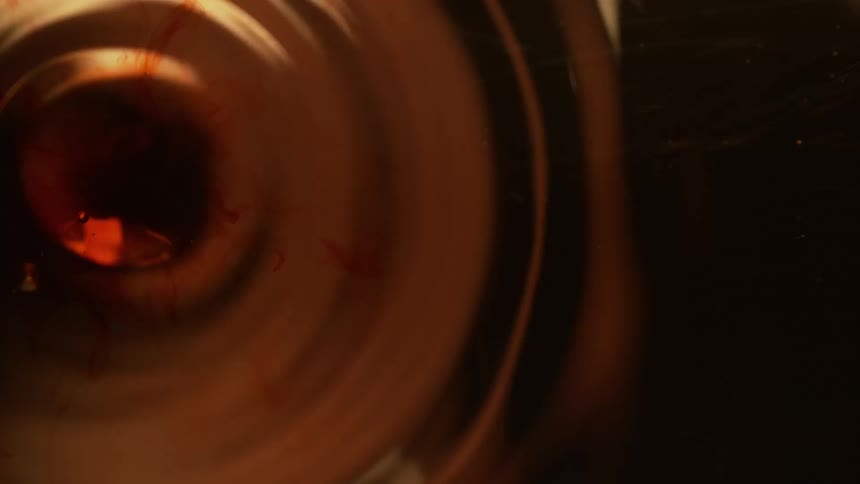 Abstract footage of a droplet of dye falling in to liquid