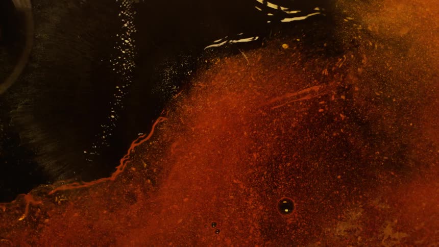 Orange film being sprayed by water